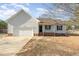 Charming single-story home with a garage and well-maintained front yard at 38 Colonial Hills Dr, Lillington, NC 27546