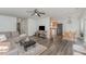 Open-concept living room with modern decor and wood-look flooring at 38 Colonial Hills Dr, Lillington, NC 27546