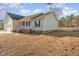 A view of the back of the house, with a lawn and fence at 38 Colonial Hills Dr, Lillington, NC 27546