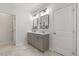 Modern bathroom with double vanity, framed mirrors, and neutral color palette at 3800 Cross Timber Ln, Raleigh, NC 27603