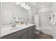Elegant bathroom with double vanity, stylish fixtures, and modern bathtub shower combination at 3800 Cross Timber Ln, Raleigh, NC 27603
