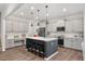 Spacious kitchen with an island, stainless steel appliances, and a cozy seating area at 3800 Cross Timber Ln, Raleigh, NC 27603