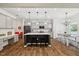 Bright, open kitchen with a large island, modern appliances, and a dining area at 3800 Cross Timber Ln, Raleigh, NC 27603