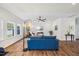 Cozy living room featuring a comfortable blue sofa and plenty of natural light from windows at 3800 Cross Timber Ln, Raleigh, NC 27603