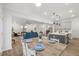 Open concept living space with kitchen island, dining table, and comfortable seating at 3800 Cross Timber Ln, Raleigh, NC 27603