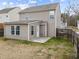 View of the back exterior, patio, yard, and vinyl siding at 3811 Chehaw Dr, Raleigh, NC 27610
