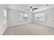 Bright bedroom with carpet flooring, a ceiling fan, and plenty of natural light at 3811 Chehaw Dr, Raleigh, NC 27610