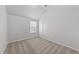 A carpeted bedroom featuring a vaulted ceiling and a window that provides natural light at 3811 Chehaw Dr, Raleigh, NC 27610