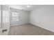 Well-lit carpeted bedroom with a window that offers an inviting and spacious atmosphere at 3811 Chehaw Dr, Raleigh, NC 27610