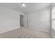 A carpeted bedroom featuring neutral walls, a door to the hallway, and ample natural light at 3811 Chehaw Dr, Raleigh, NC 27610