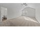 Large bedroom featuring carpeted floors, natural light, and ensuite bathroom at 3811 Chehaw Dr, Raleigh, NC 27610