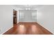 Open-concept dining room with hardwood floors and plenty of natural light from windows at 3811 Chehaw Dr, Raleigh, NC 27610
