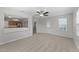 Open-concept living room with views of the kitchen and access to the backyard at 3811 Chehaw Dr, Raleigh, NC 27610