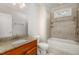 Bathroom features a vanity with granite countertops, stylish fixtures, and a tiled shower and tub combination at 4 Tocuvan Pl, Durham, NC 27705