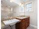 Bathroom features double sink vanity with granite counters, stylish fixtures, and a large mirror at 4 Tocuvan Pl, Durham, NC 27705