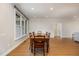 Dining room with a large window, hardwood floors, and ample space for entertaining guests at 4 Tocuvan Pl, Durham, NC 27705