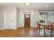 Inviting entryway with a wood door, sidelights, and beautiful flooring at 4 Tocuvan Pl, Durham, NC 27705