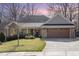 Charming brick home featuring a well-manicured front yard at 4 Tocuvan Pl, Durham, NC 27705