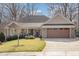 Charming one-story brick home with a well-manicured lawn and inviting front porch at 4 Tocuvan Pl, Durham, NC 27705