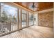 Relaxing sunroom with wood ceiling and brick wall overlooks pool and deck at 4 Tocuvan Pl, Durham, NC 27705