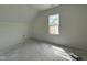 Bright attic space with window and storage closet ready for finishing at 432 Springtooth Dr, Zebulon, NC 27597