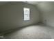 Unfinished attic space with window and storage closet ready for finishing at 432 Springtooth Dr, Zebulon, NC 27597