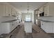 Bright, new kitchen with white cabinets, granite countertops, stainless appliances, and a center island at 432 Springtooth Dr, Zebulon, NC 27597