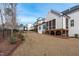 Backyard view showcasing the home's screened porch at 4508 Chandler Creek Pl, Apex, NC 27539