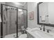 Modern bathroom with glass-enclosed shower, marble countertop vanity, and stylish fixtures at 4508 Chandler Creek Pl, Apex, NC 27539