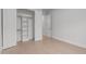 Empty bedroom with hardwood floors, closet, and neutral walls, offering a versatile space at 4508 Chandler Creek Pl, Apex, NC 27539