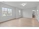 An empty bedroom with large windows for an abundance of natural light at 4508 Chandler Creek Pl, Apex, NC 27539