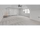 Large bonus room featuring neutral carpet, ceiling fan, lots of natural light, and ample space at 4508 Chandler Creek Pl, Apex, NC 27539