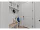 Functional entryway with a built-in bench, storage cubbies, and hooks for organizing coats and bags at 4508 Chandler Creek Pl, Apex, NC 27539