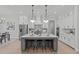 Bright kitchen featuring an island with bar seating, pendant lighting, and stainless steel appliances at 4508 Chandler Creek Pl, Apex, NC 27539