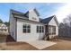Rear exterior view of a charming home with a screened porch and manicured lawn at 4508 Chandler Creek Pl, Apex, NC 27539