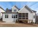 Rear exterior view of a charming home with a screened porch and manicured lawn at 4508 Chandler Creek Pl, Apex, NC 27539