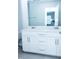 Modern bathroom featuring double vanity, white cabinetry, and brushed nickel hardware at 4914 Arkose Dr, Raleigh, NC 27610