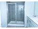 Bright bathroom showcasing a glass-enclosed shower and vanity with a sink at 4914 Arkose Dr, Raleigh, NC 27610