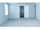 A spacious bedroom with neutral walls and carpet, featuring a window with blinds and a doorway at 4914 Arkose Dr, Raleigh, NC 27610