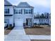 Charming two-story townhouse with a one car garage and well-manicured front lawn at 4914 Arkose Dr, Raleigh, NC 27610