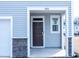 Close up of the front door and entrance to a two story home at 4914 Arkose Dr, Raleigh, NC 27610