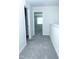 Upstairs hallway showcasing carpeted floor leading to bedrooms and other rooms at 4914 Arkose Dr, Raleigh, NC 27610
