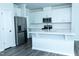Beautiful kitchen with white cabinets, stainless steel appliances, and center island at 4914 Arkose Dr, Raleigh, NC 27610