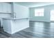 Open concept living room and kitchen featuring white cabinets and island at 4914 Arkose Dr, Raleigh, NC 27610
