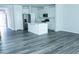 Bright, open kitchen featuring white cabinets, stainless steel appliances, and a center island at 4914 Arkose Dr, Raleigh, NC 27610