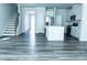 Open concept living room and kitchen with hard surface flooring at 4914 Arkose Dr, Raleigh, NC 27610