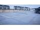 View of the community tennis court featuring new net and fencing at 4914 Arkose Dr, Raleigh, NC 27610