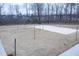 Outdoor sand volleyball court with string lights is perfect for enjoying friendly competition in the community at 4914 Arkose Dr, Raleigh, NC 27610
