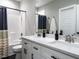 Bathroom featuring a dual sink vanity with white cabinets and a shower and tub combo at 5 Morning Dove Ct, Clayton, NC 27520