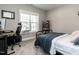 Comfortable bedroom with desk, chair and bed in front of a large window at 5 Morning Dove Ct, Clayton, NC 27520